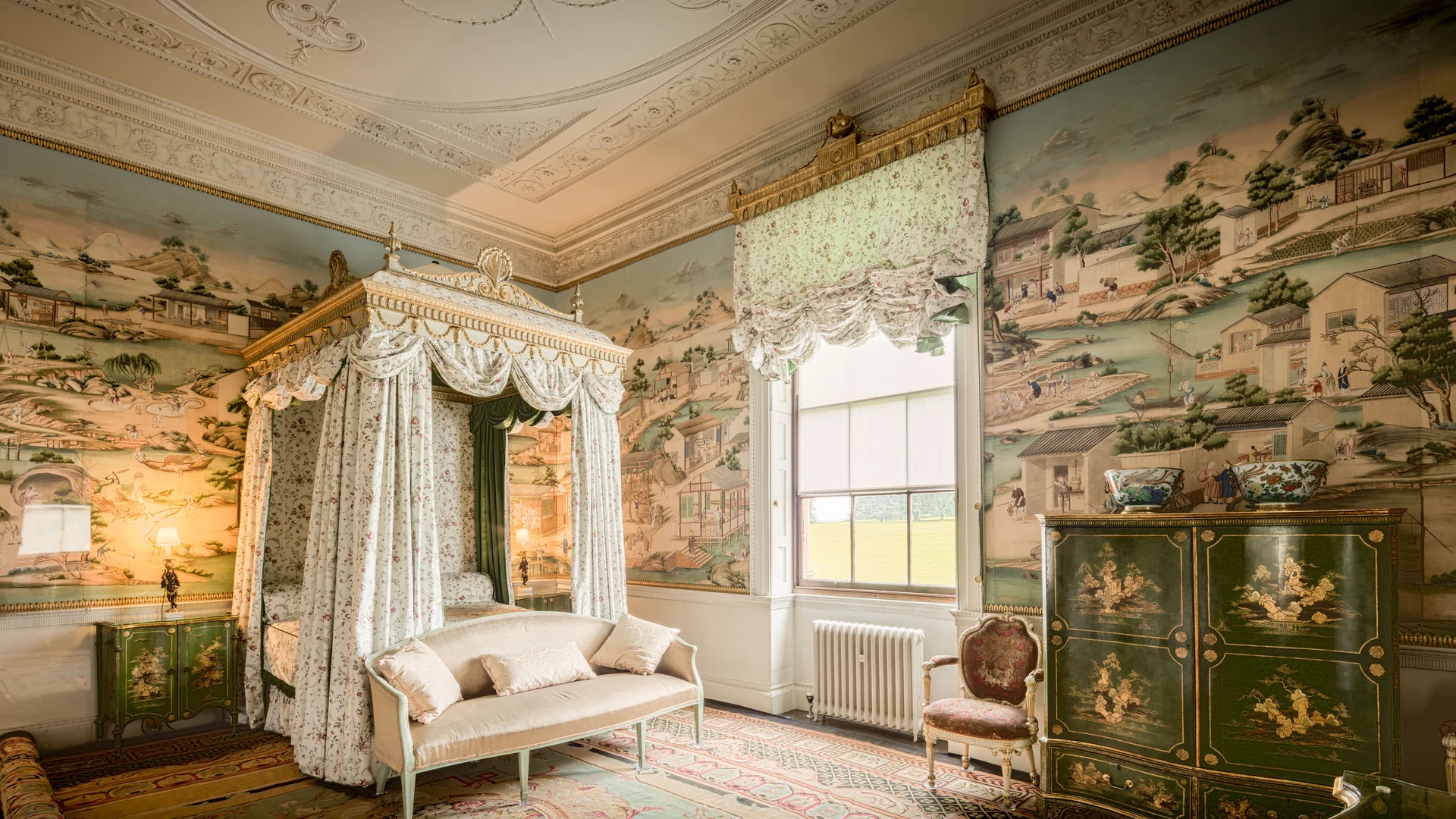 Bedroom two, hung with hand-painted Chinese paper under a decorated plaster ceiling